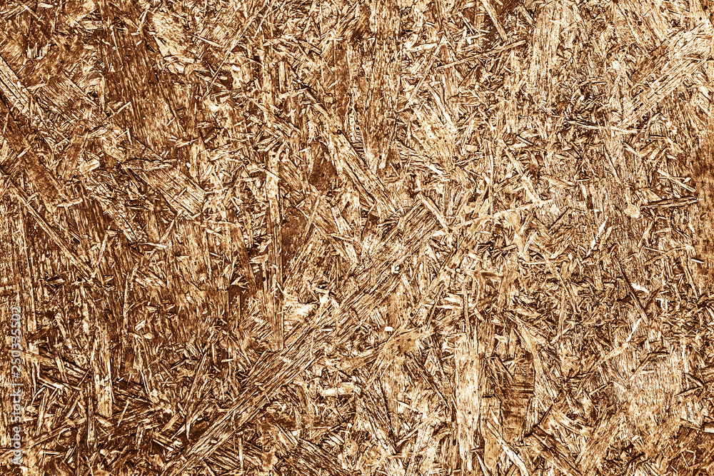 Brown chip board background. Wooden osb plywood pattern texture. Brown chip board background. Wooden osb plywood pattern texture.