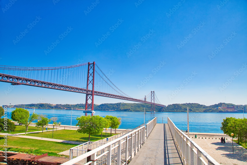 Lisbon, Portugal-October 17, 2017: Landmark suspension 25 of April bridge over Tagus River in Lisbon
