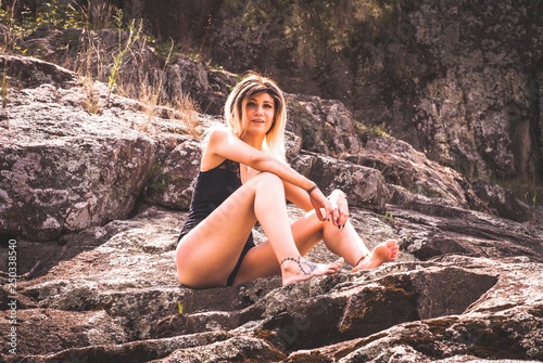 young woman on rock
