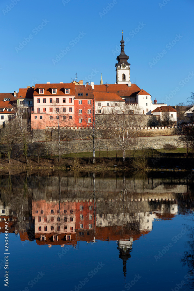 Sunny winter royal medieval Town Pisek with the Castle above the river Otava, Czech Republic 