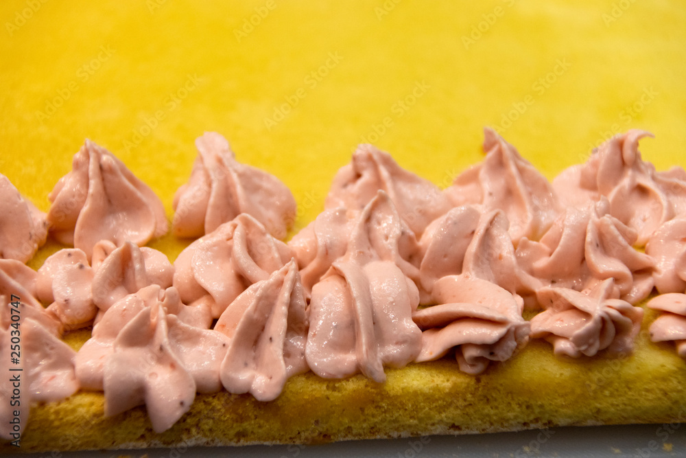  Preparation of cake with strawberry cream ornament, traditional pastry in Latin America.