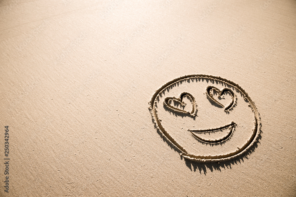 Romantic Valentine S Day Drawing Of A Smiley Face Emoji With Love Heart Eyes Handwritten In Smooth Sand Copy Space Under Bright Sun Foto De Stock Adobe Stock Romantic Valentine S Day Drawing Of A Smiley Face Emoji With Love Heart Eyes Handwritten In Smooth Sand Copy Space Under Bright Sun Foto De Stock Adobe Stock