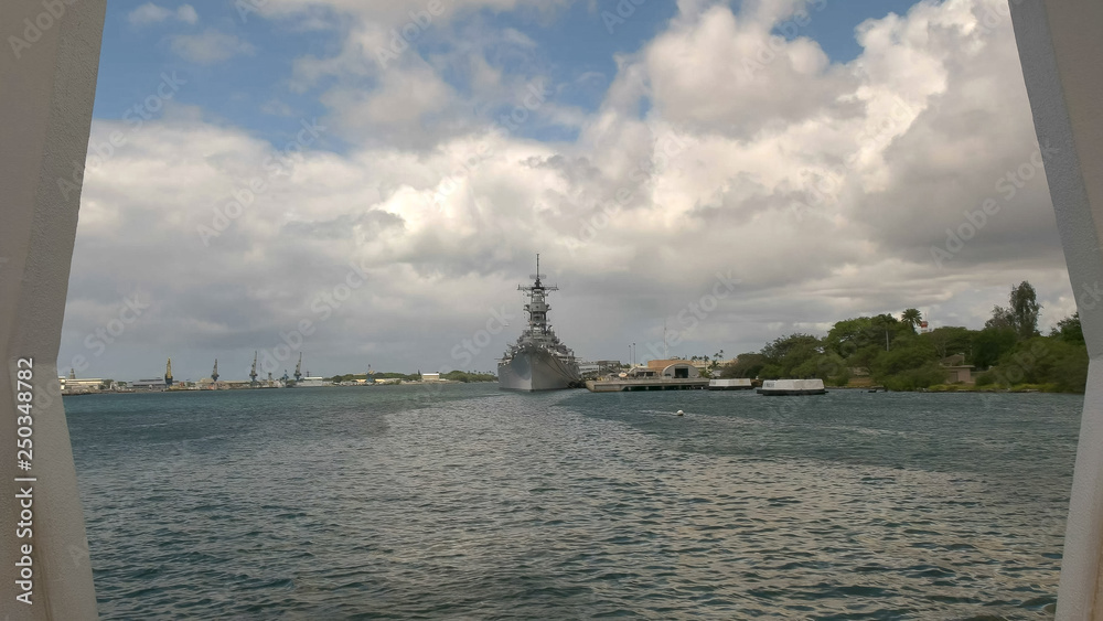 the uss missouri as seen from the arizona memorial at pearl harbor