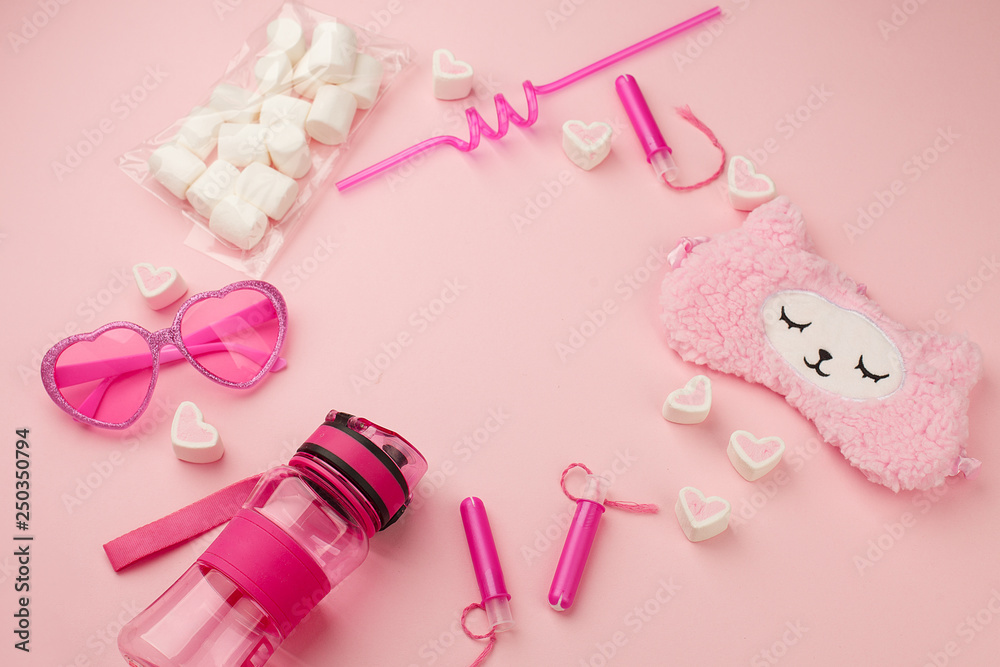 pink fashion trendy woman's girl set with heart shaped sunglasses, sleep band, tampon, straw, sweetness on candy pink background, sunshine summer concept pink fashion trendy woman's girl set with heart shaped sunglasses, sleep band, tampon, straw, sweetness on candy pink background, sunshine summer concept