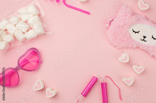 pink fashion trendy woman's girl set with heart shaped sunglasses, sleep band, tampon, straw, sweetness on candy pink background, sunshine summer concept