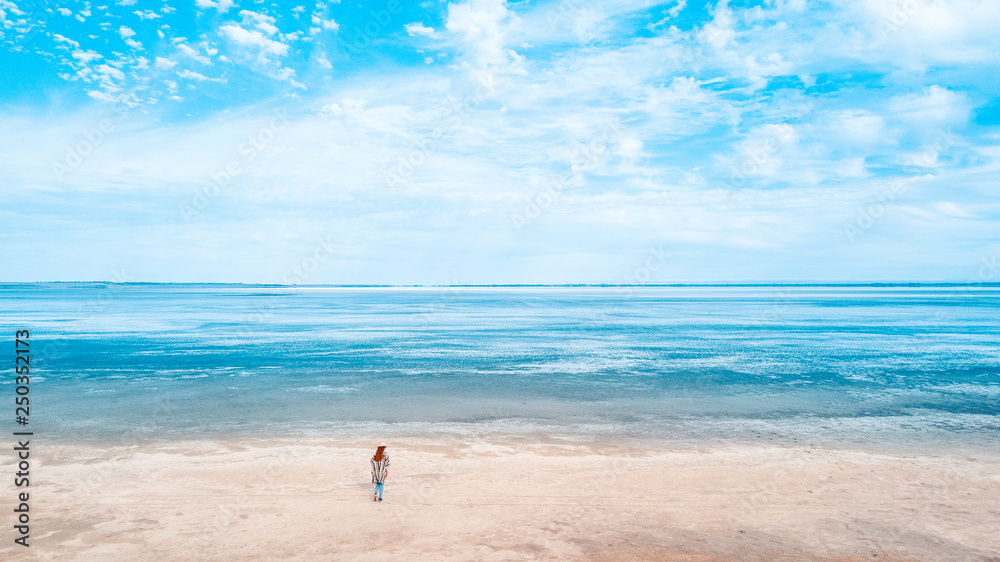 Person and Lake Landscape. Aerial View to show the vastness of the lake Person and Lake Landscape. Aerial View to show the vastness of the lake