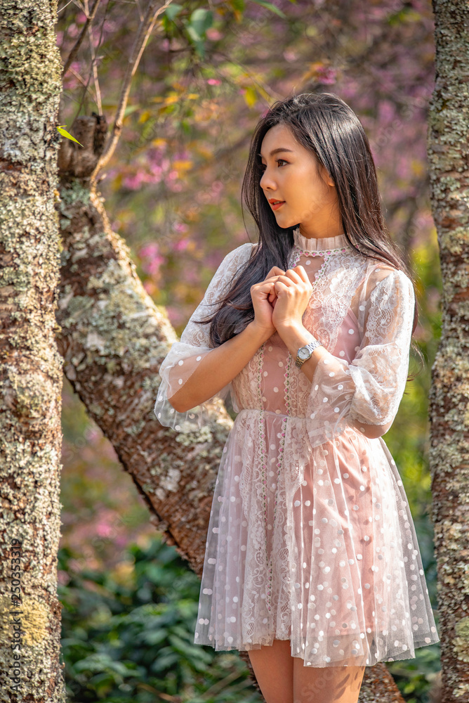 Beautiful young teenage girl posing under a trees. Beautiful young teenage girl posing under a trees.