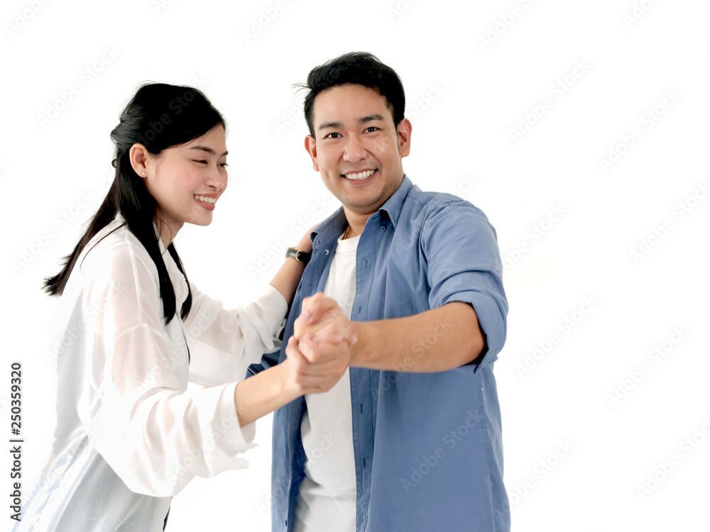 Asian couple dancing together on white backgrond lifestyle concept. Motion blur. Asian couple dancing together on white backgrond lifestyle concept. Motion blur.