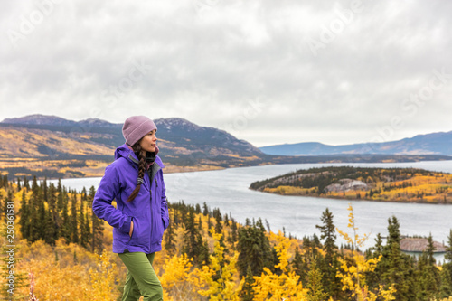 Hike nature outdoors Asian hiker woman relaxing walking happy in mountains of Alaska landscape background. USA travel in autumn.
