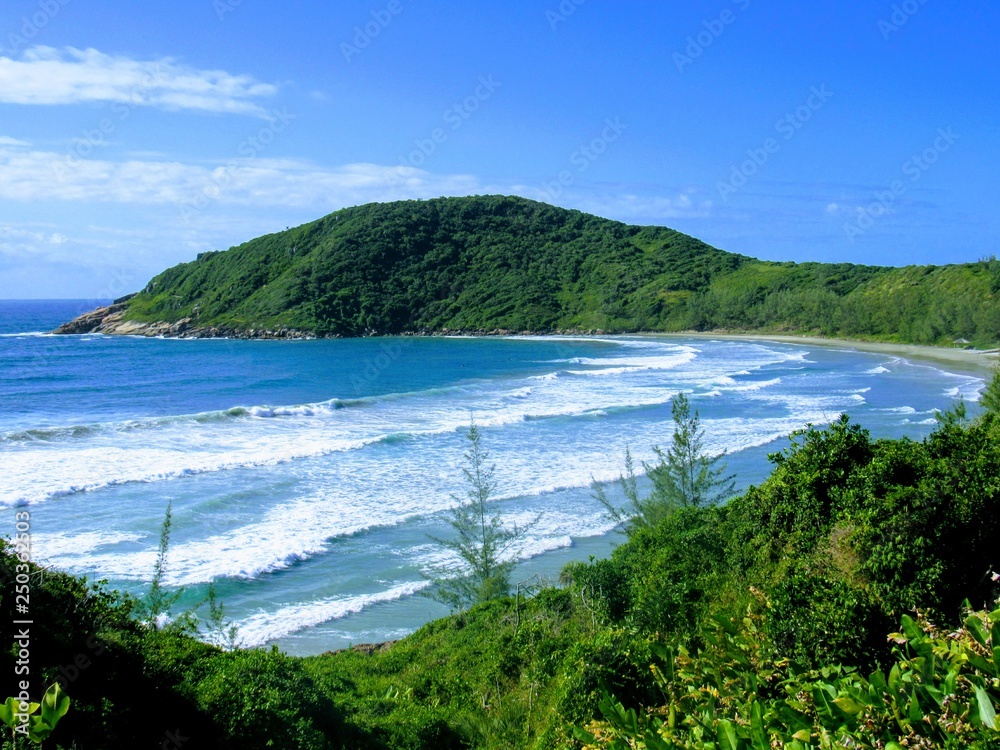 Beach, rocks, crystal clear water, trails, natural water pools, green plants and sun. Beach, rocks, crystal clear water, trails, natural water pools, green plants and sun.