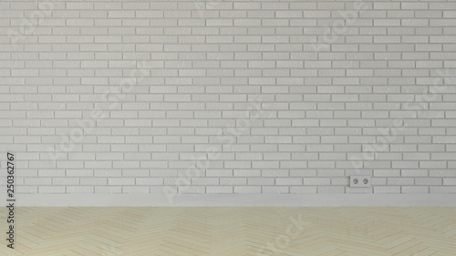 Empty room with brick wall and parquet flooring