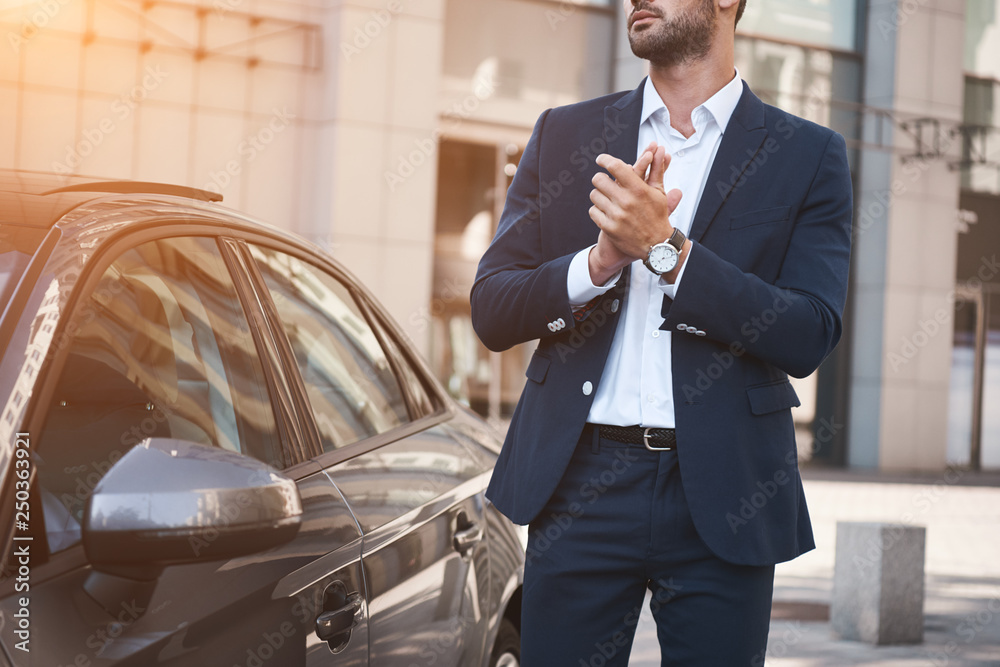 Young businessman near new car wating for meeting - obrazy, fototapety, plakaty 
