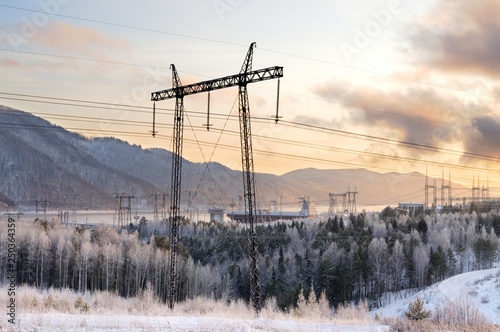 Electricity pylons and winter sunset near the Krasnoyarsk Hydroelectric Power Station in Siberia, Russia