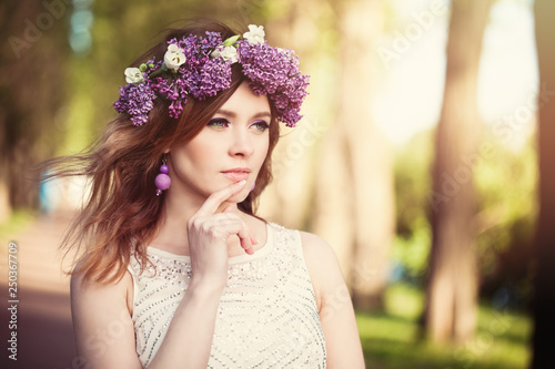 Cheerful woman outdoors on spring background