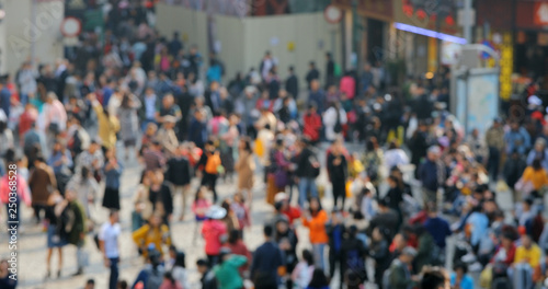 Blur of people walk in the street © leungchopan