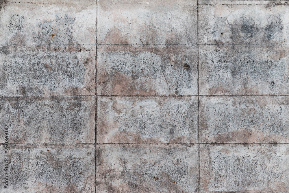 The old gray concrete block wall for background and texture which got some rusty color. The rectangle pattern. The old gray concrete block wall for background and texture which got some rusty color. The rectangle pattern.