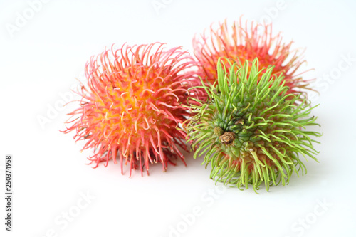 Colourful rambutan fruits on white background