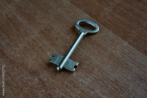old key on a wooden surface © Александр Могилевцев