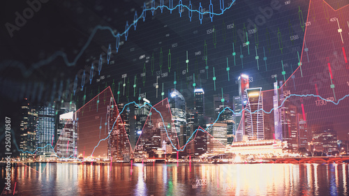 Trading graph on the cityscape at night background. Business and financial concept. Double exposure. Singapore photo