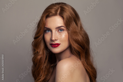Natural beauty. Redhead european girl with red hair and healthy tanned skin with freckles