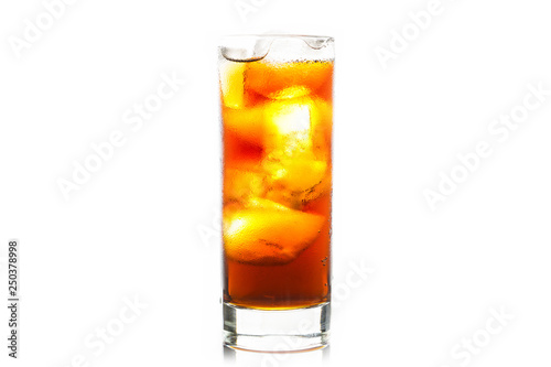 Cold cola beverage in glass with ice isolated on white background. Selective focus. Shallow depth of field.