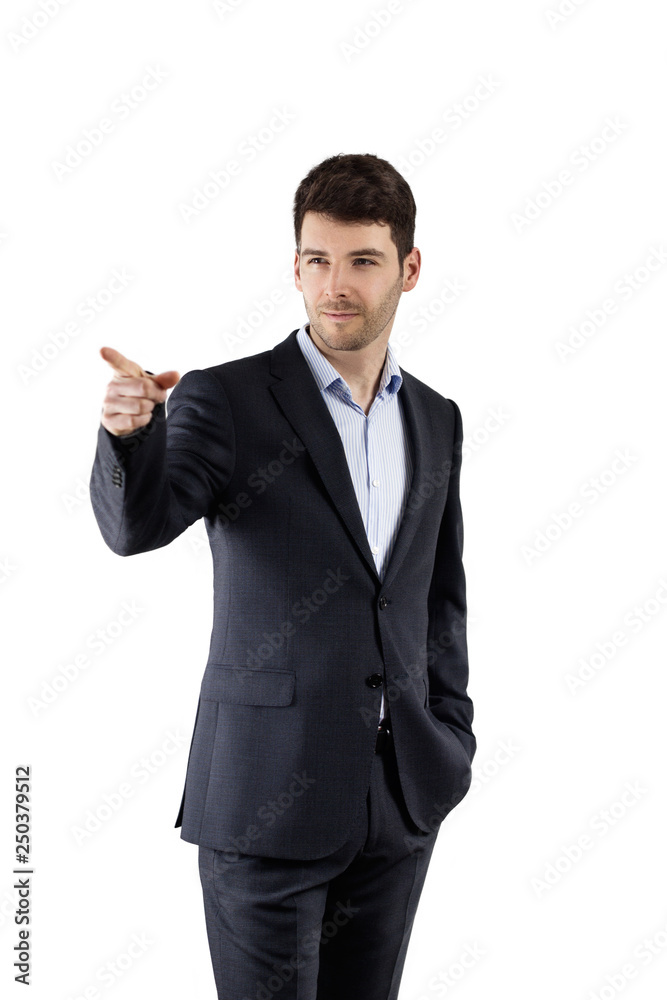 Confident looking businessman dressed in a suit pointing at someone or something Confident looking businessman dressed in a suit pointing at someone or something