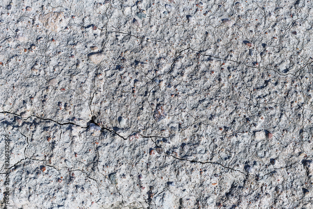 Naklejka premium a view of the land with many small cracks from catastrophic climate change