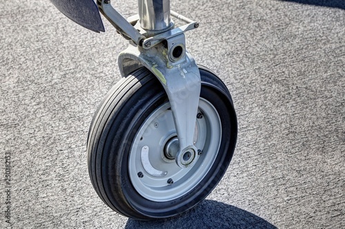 Small jet airplane front wheel on the stand