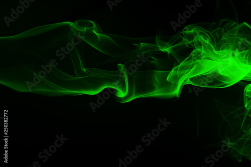 Green smoke on black background and darkness concept