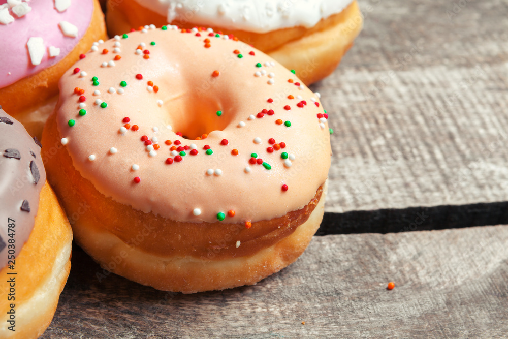 Glazed donuts on wooden background Glazed donuts on wooden background