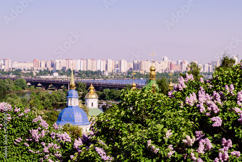 Orthodox church in the garden of blooming lilac Ukraine, Kiev photo