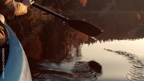 Paddle a canoe at sunset