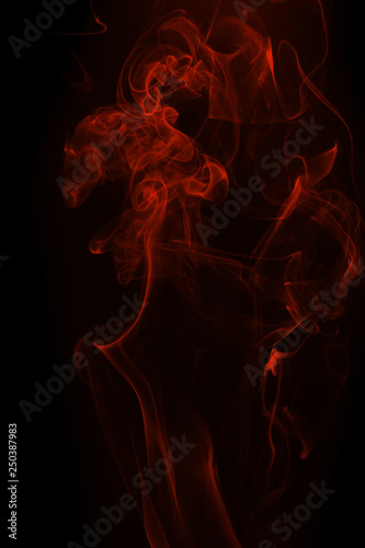 Movement of red smoke on black background