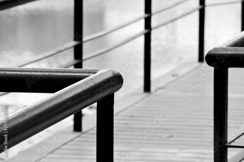 closeup steel railing in the park - monochrome