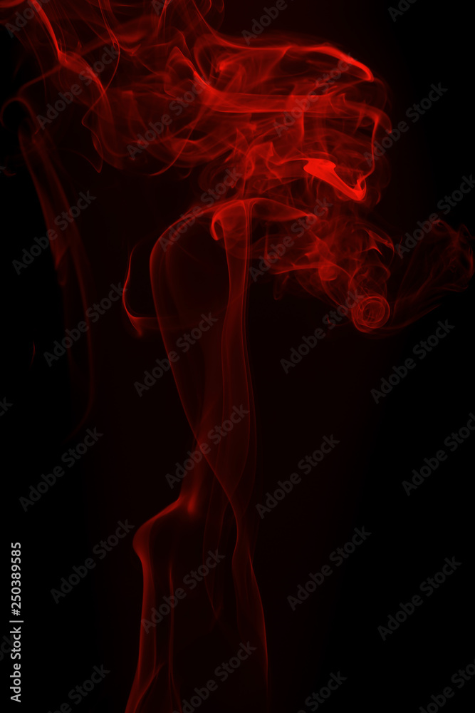 Movement of red smoke on black background for art design