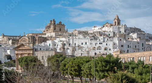 Panorama of The picturesque old town and Roman Catholic cathedral and church Confraternity of Carmine. The white city in Apulia on the hill - Ostuni , Puglia , Brindisi , Italy
