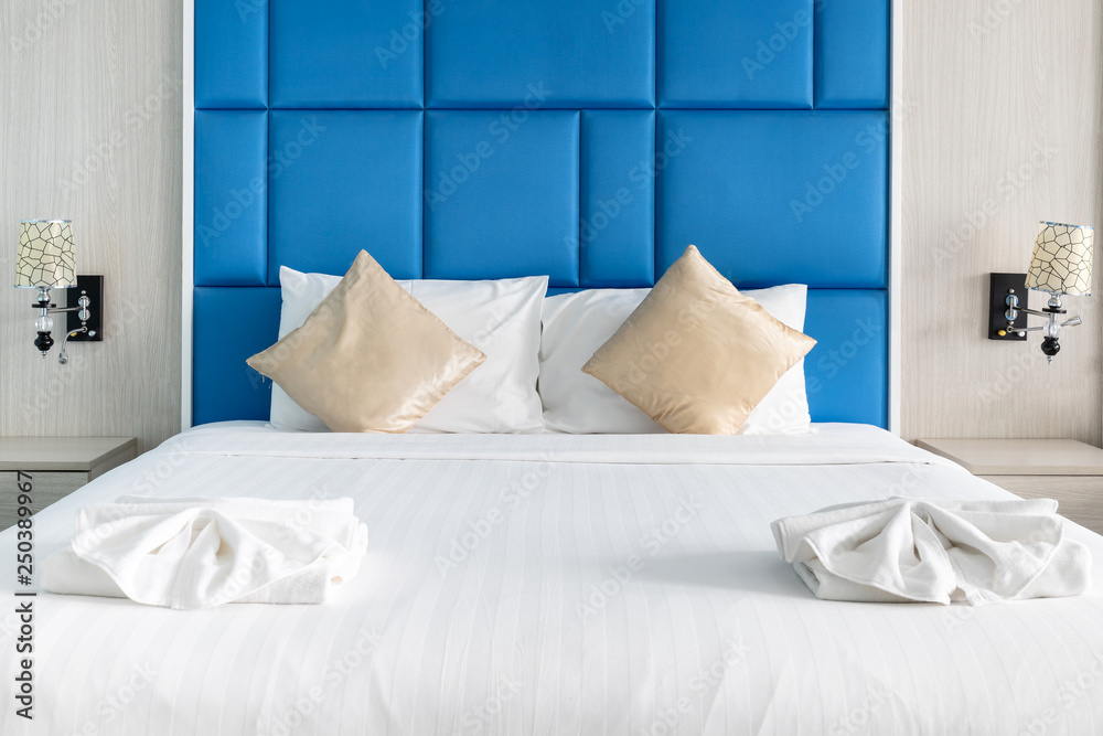  Bed and couple pillows in modern bedroom decorate with blue color tone