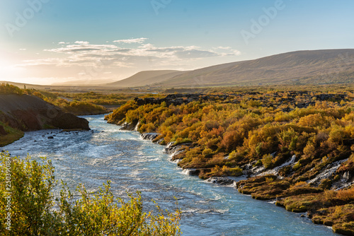 The beautiful Hraunfossar in Iceland, in vibrant autumn colors photo