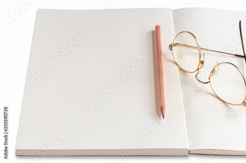 Notebook and pencil on the white table. Space for your text or message.