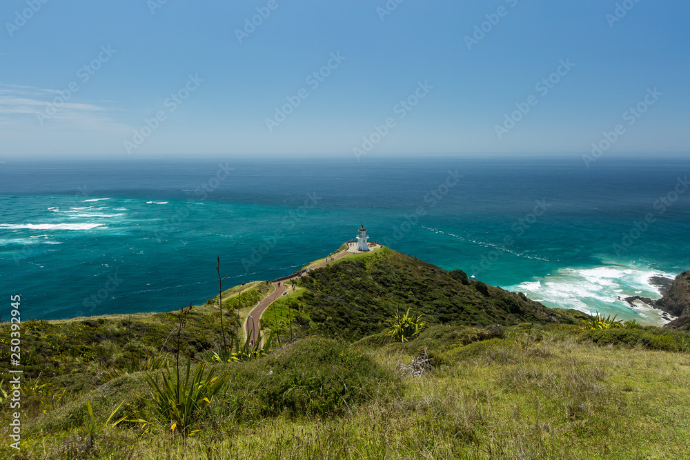 View form above to the Cape Reinga lighthouse, on the left meeting point of Tasman sea and South Pacific Ocean
