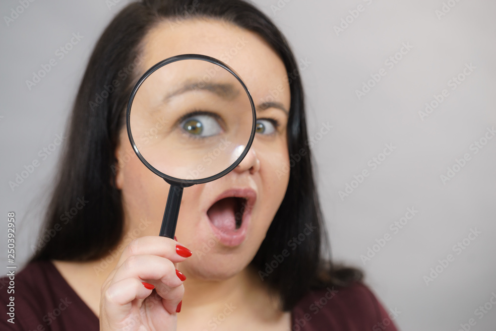 Adult woman with magnifying glss Adult woman with magnifying glss
