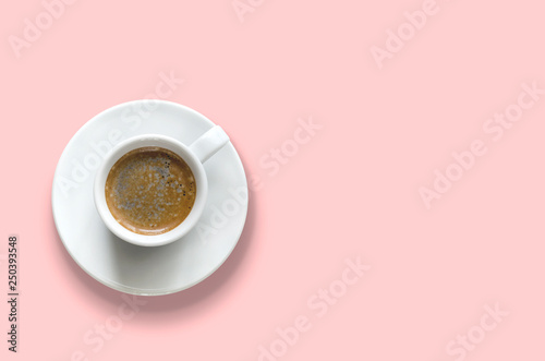 Isolated cup of coffee on a pink background. Flat lay, top view, copy space. Minimum summer concept.