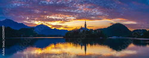 beautiful  spectacular and colorful sunrise over the lake Bled S  owenii.Panorama