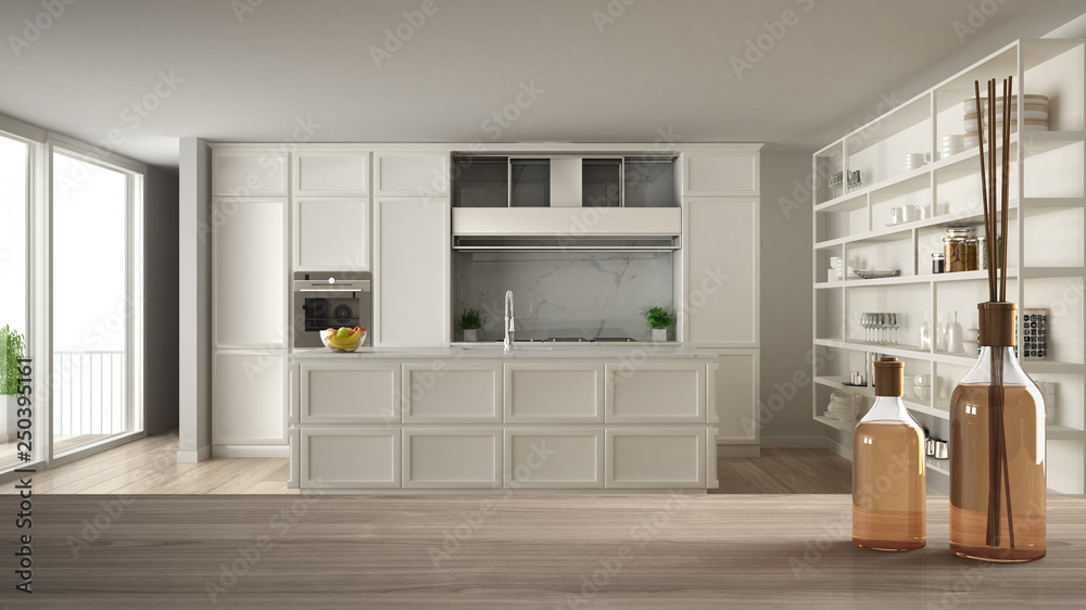 Wooden table top or shelf with aromatic sticks bottles over blurred classic white kitchen with island in modern luxury apartment, white architecture interior design Wooden table top or shelf with aromatic sticks bottles over blurred classic white kitchen with island in modern luxury apartment, white architecture interior design