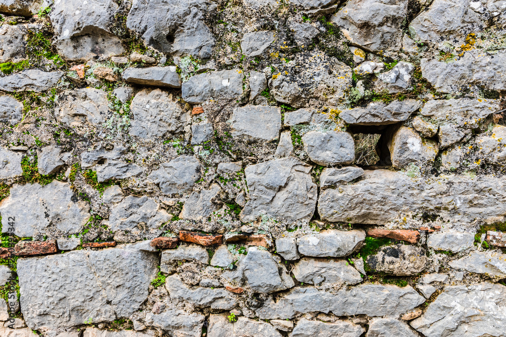 beautiful background of large stones overgrown with grass beautiful background of large stones overgrown with grass