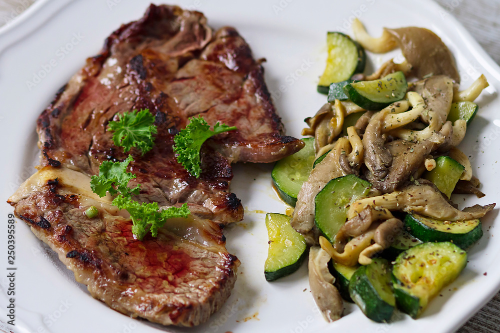 A grilled veal chop with vegetables