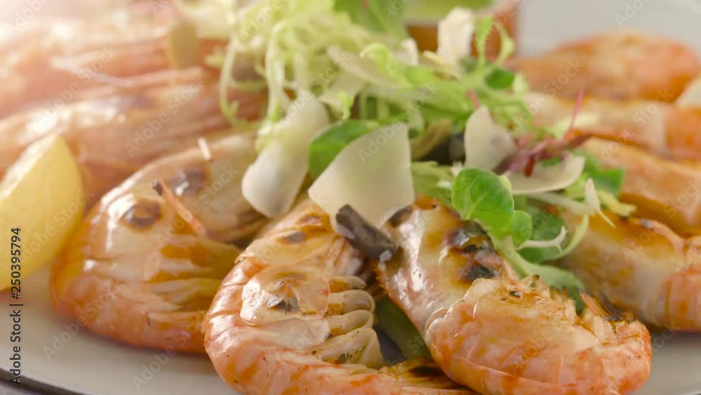 Grilled tiger shrimps with asparagus and lemon. Grilled seafood. Grilled tiger shrimps with asparagus and lemon. Grilled seafood.