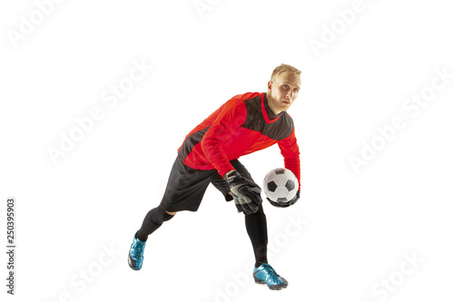 One male soccer player goalkeeper standing and holding ball. Silhouette isolated on white studio background © master1305