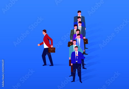 Businessman leaving the crowd alone