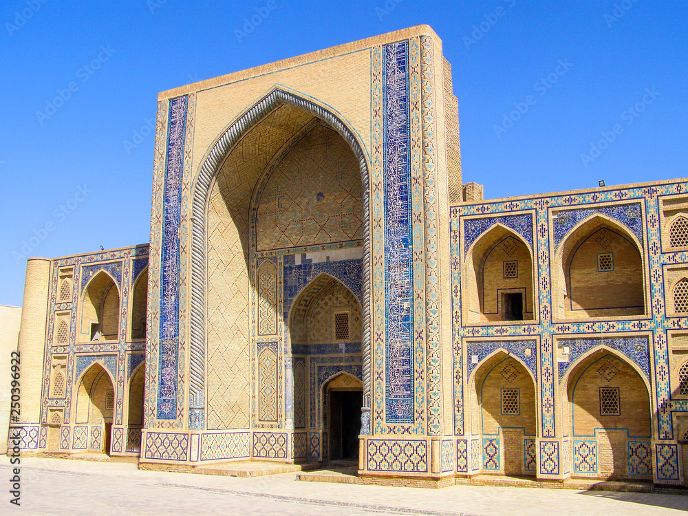 Side View of Ulugbek Medressa, the oldest madrasah of Central Asia, in Bukhara, Uzbekistan.